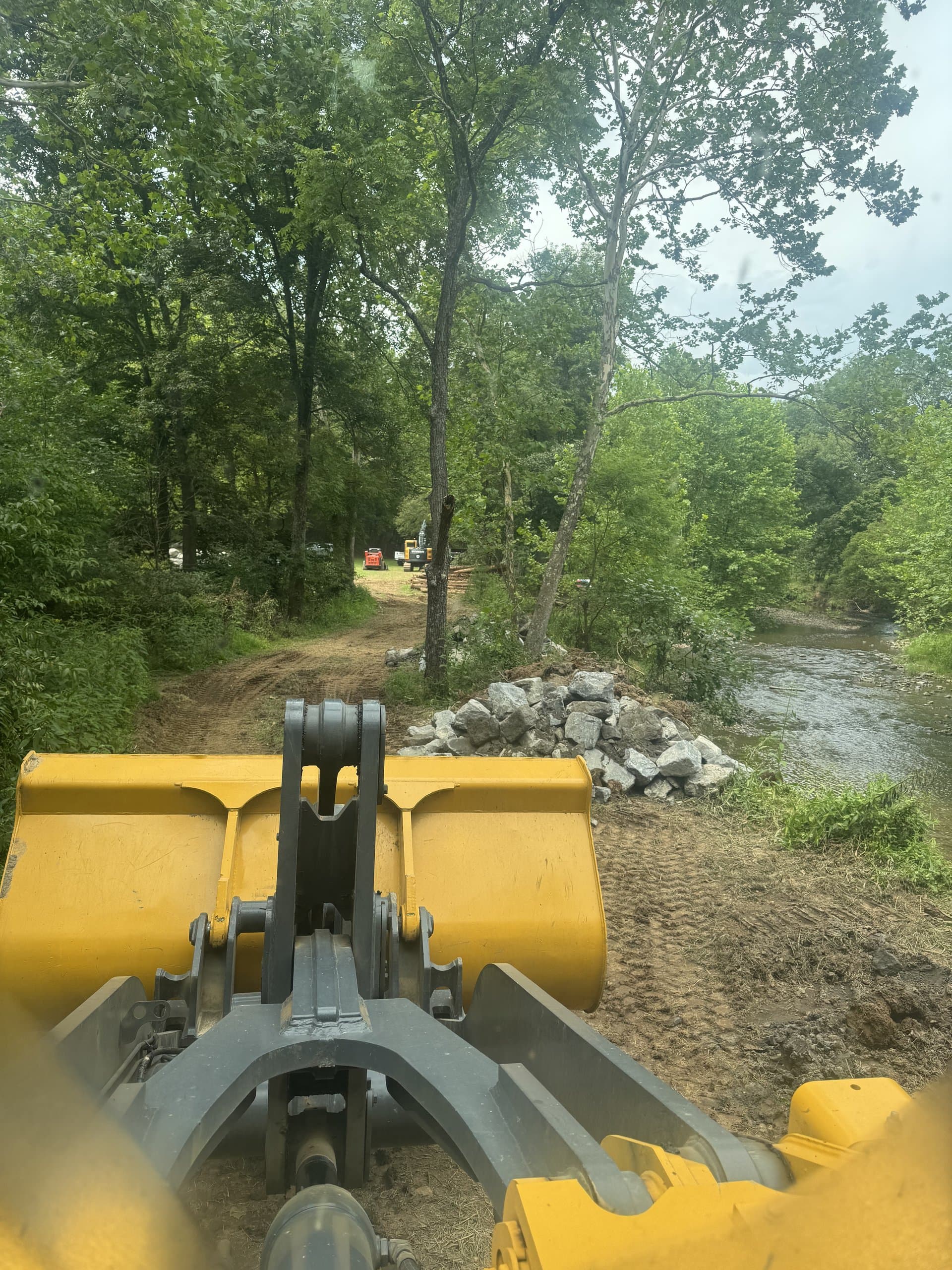 EW Wise yellow tractor parked on a residential job between phases