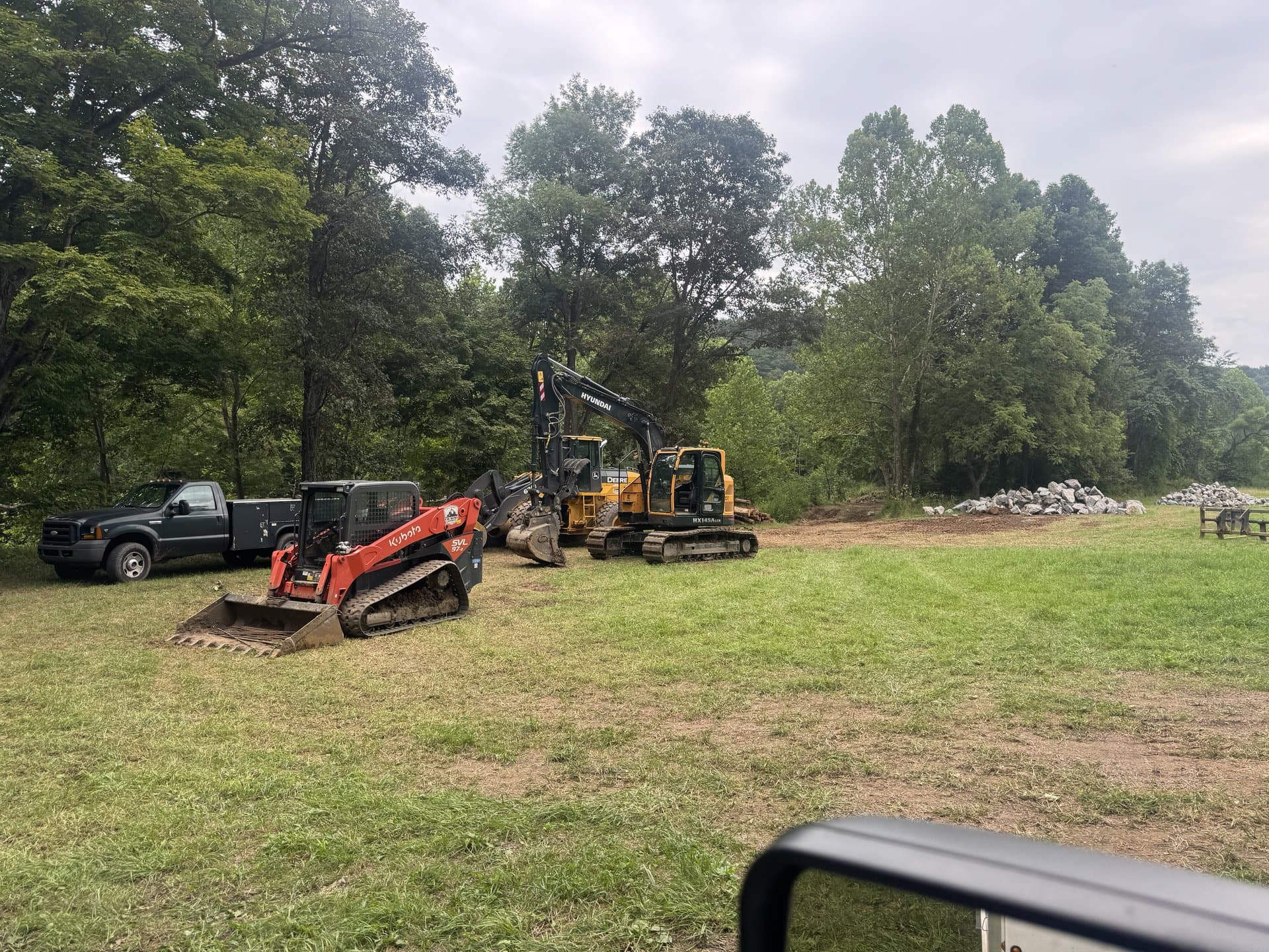 EW Wise skid steer and tractor staged together for the next job