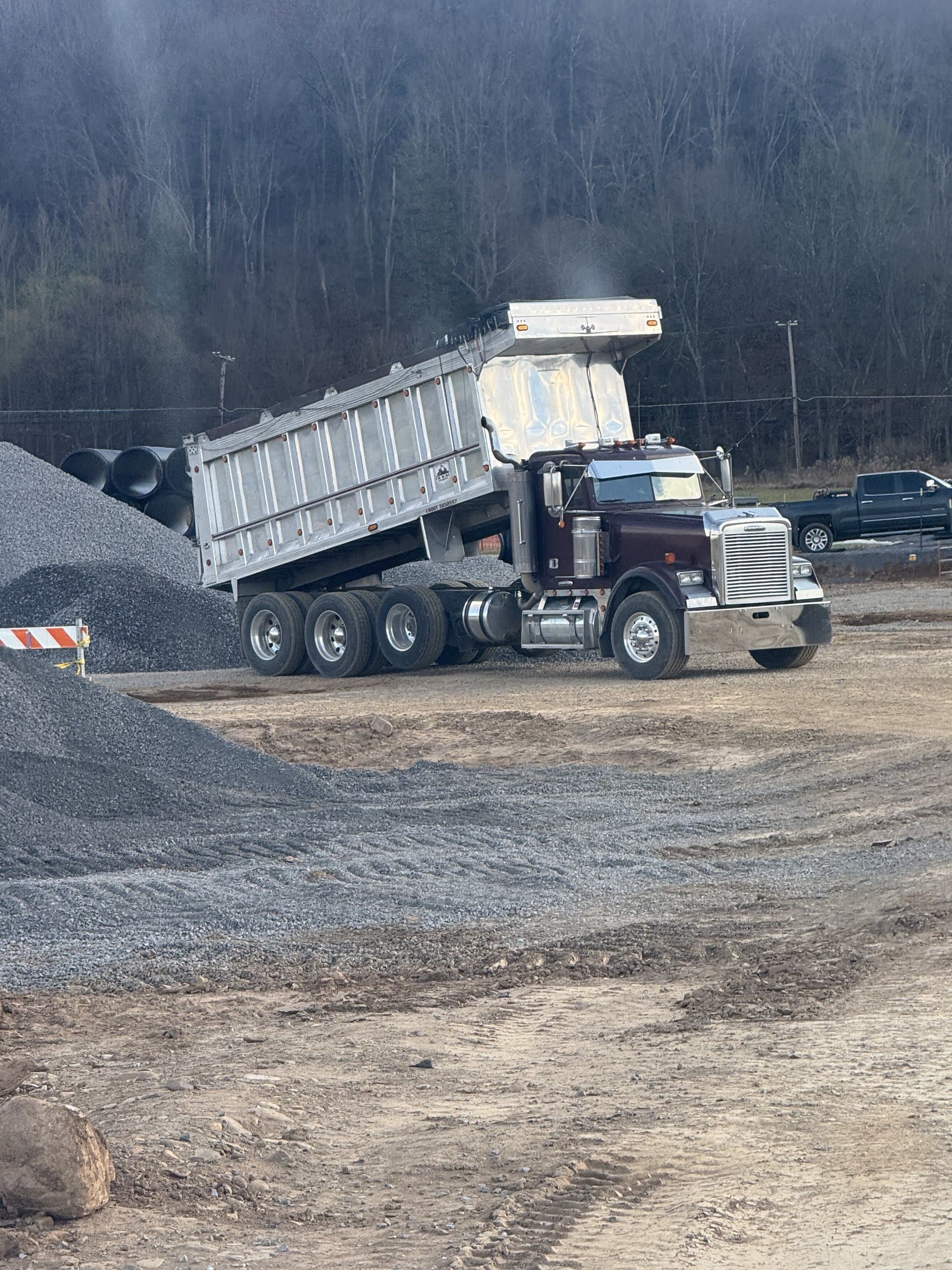 EW Wise dump truck tarped down and ready to roll out