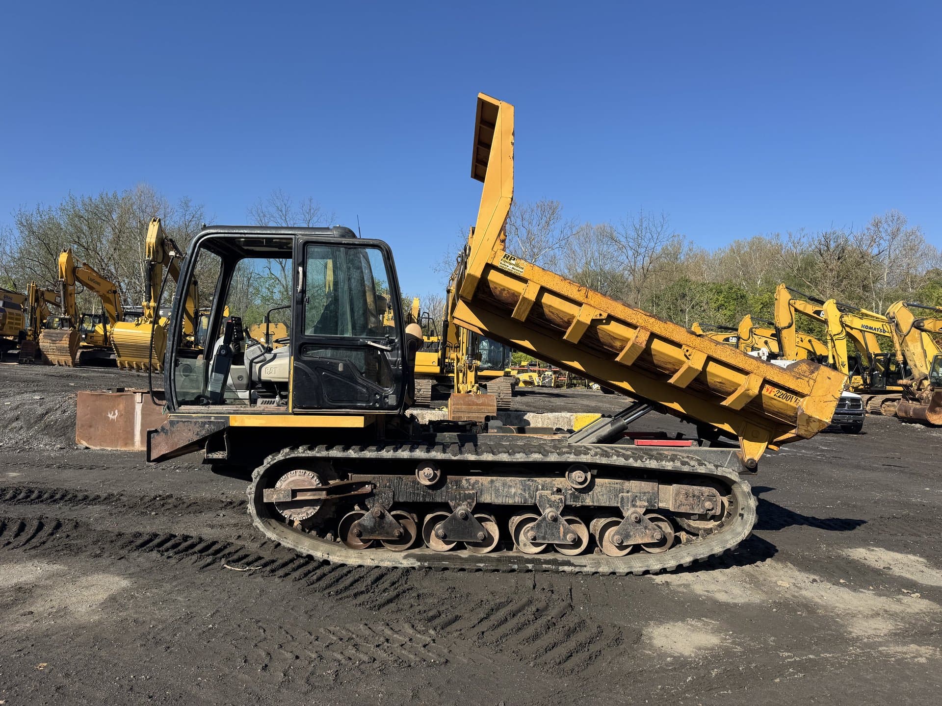 Excavator and dozer parked together in the yard between jobs