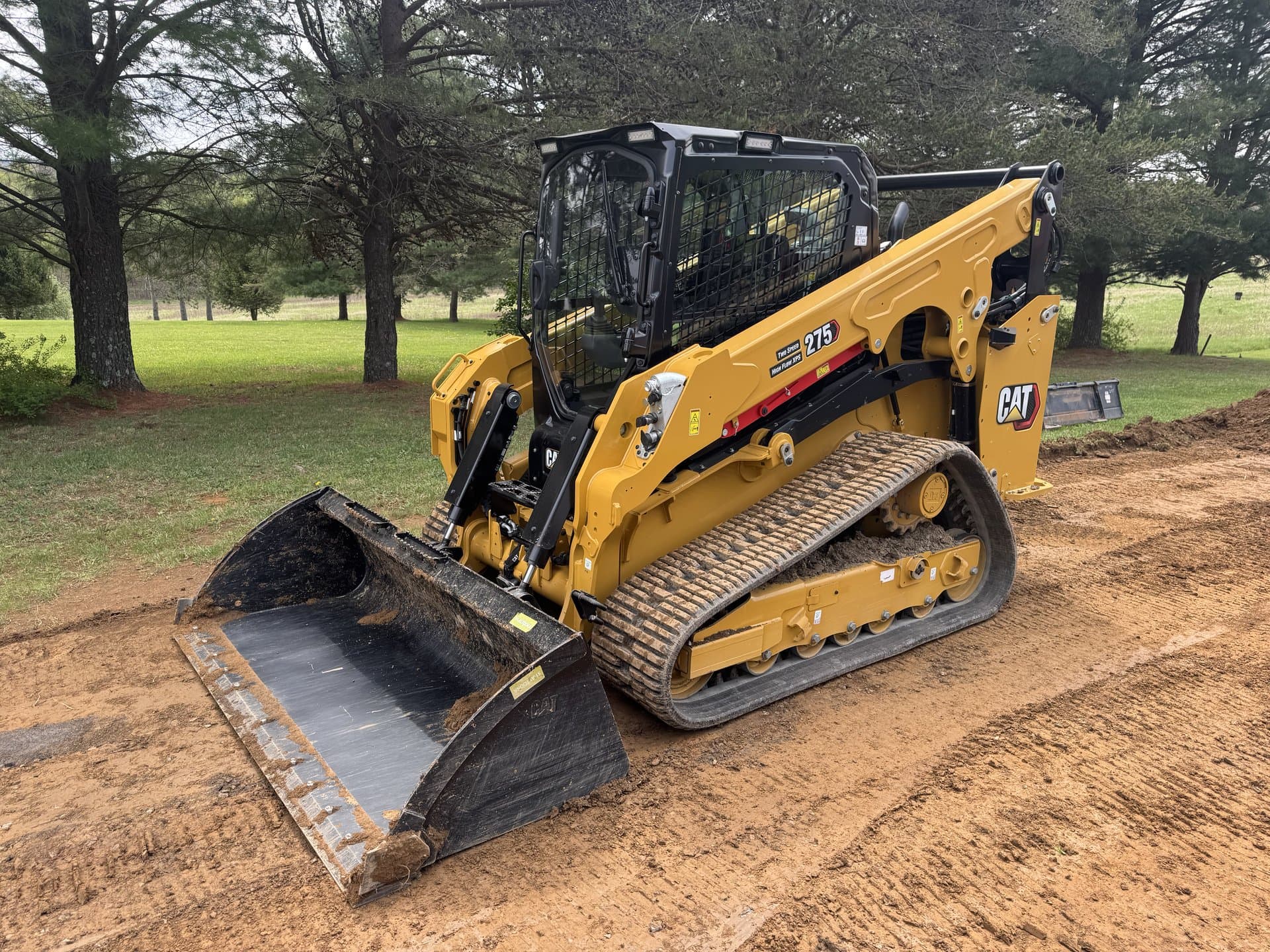 Tracked skid steer staged and ready to roll on a Bedford site